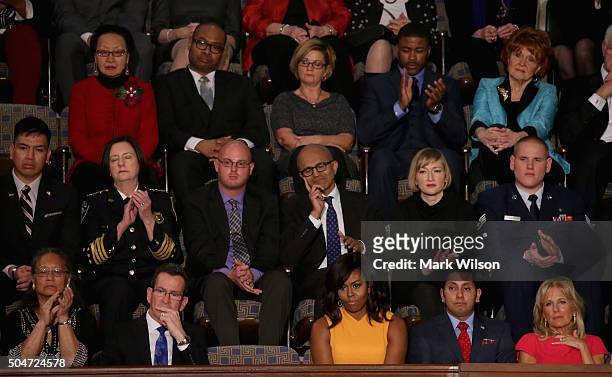 Gov. Dannel P. Malloy of Connecticut, A vacant seat for the victims of gun violence, first lady Michelle Obama, Naveed Shah of Springfield, VA., wife...