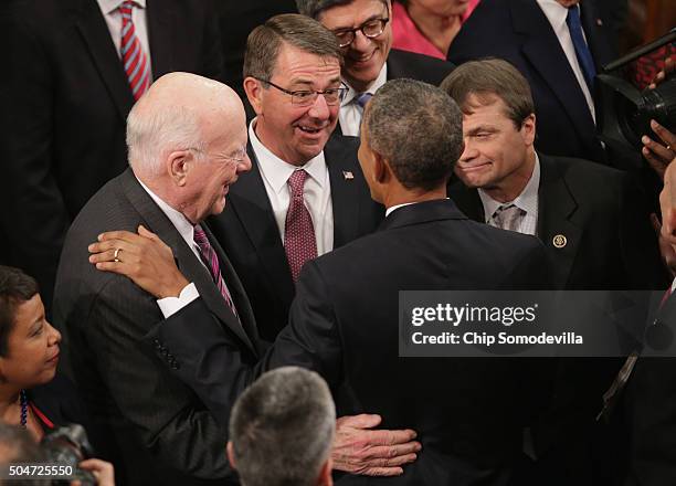 Secretary of Defense Ashton Carter speaks with US President Barack Obama after delivering the State of the Union speech before members of Congress in...