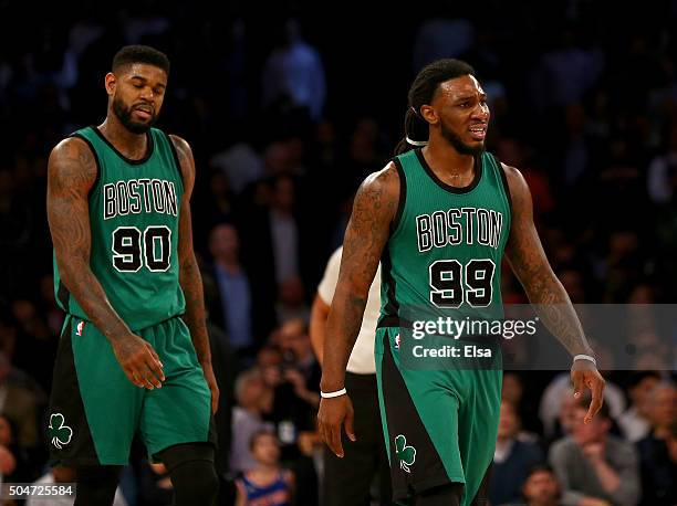 Amir Johnson and Jae Crowder of the Boston Celtics react to the loss to the New York Knicks at Madison Square Garden on January 12, 2016 in New York...