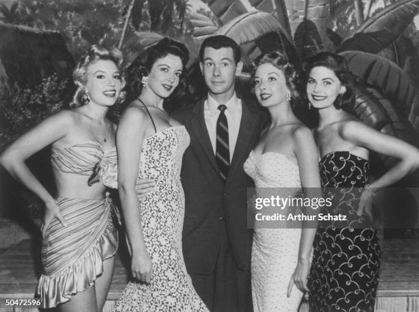 Personality Johnny Carson flanked by four Carson Cuties from an early TV show called The Johnny Carson Show, not to be confused with The Tonight Show...