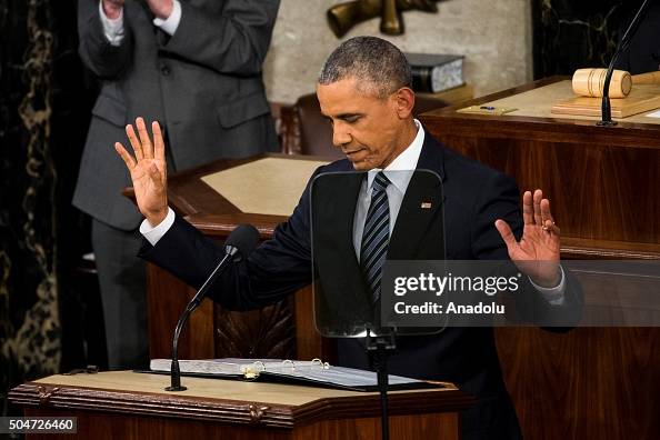Obama Rasing His Hand U.S. President Barack Obama raises his hands in thanks when he... News ...