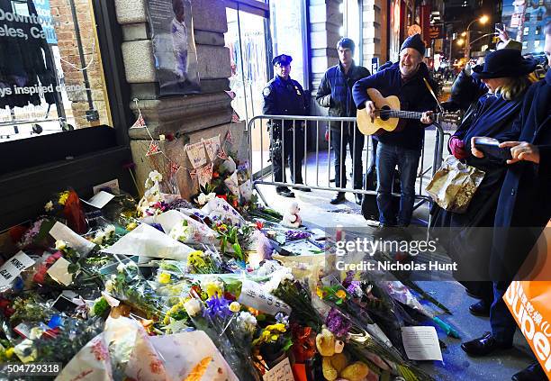 Musician Glen Hansard performs as fans and well-wishers gather to pay tribute to David Bowie at his New York City home on January 12, 2016 in New...