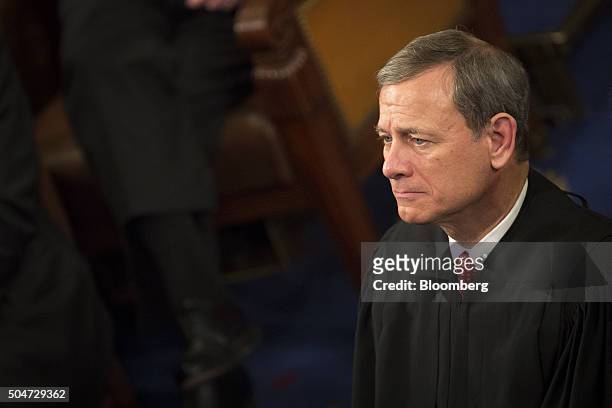 Chief Supreme Court Justice John Roberts listens as U.S. President Barack Obama delivers the State of the Union address to a joint session of...
