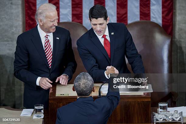 Vice President Joseph "Joe" Biden, left, looks on as U.S. House Speaker Paul Ryan, a Republican from Wisconsin, right, greets U.S. President Barack...