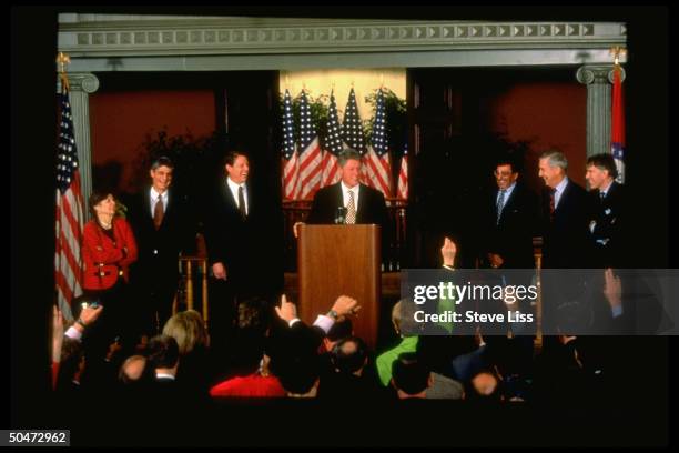 Pres-elect Bill Clinton flanked by economic appointees Altman, Bentsen, Panetta, VP-elect Gore, Rubin & Rivlin during announcement press conf.