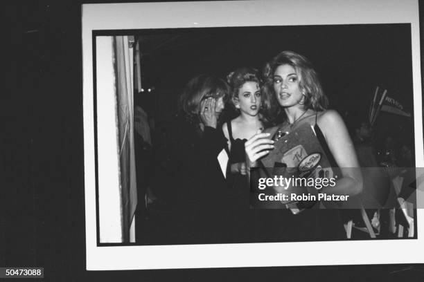 Movie dir./actress Penny Marshall, actress Bitty Schram & model-MTV hostess Cindy Crawford, chatting at premiere party for the movie A League of...