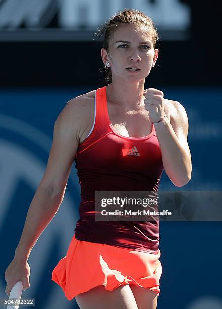 Simona Halep of Romania celebrates winning set point in her match against Karolina Pliskova of the Czech Republic during day four of the Sydney...