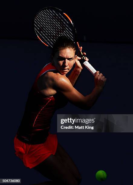 Simona Halep of Romania plays a backhand in her match against Karolina Pliskova of the Czech Republic during day four of the Sydney International at...