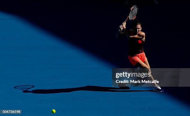 Simona Halep of Romania plays a backhand in her match against Karolina Pliskova of the Czech Republic during day four of the Sydney International at...