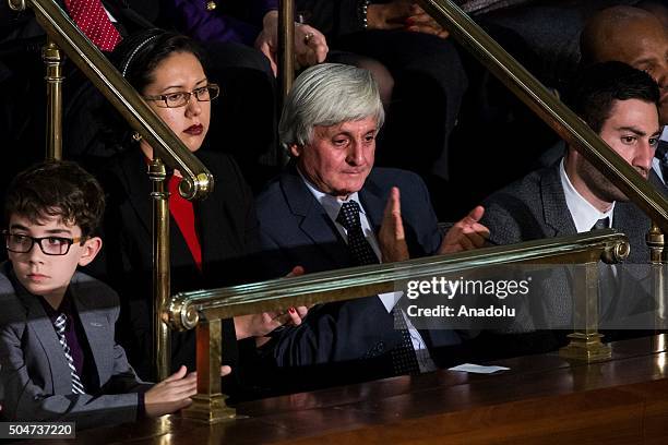 Dr. Rafai Hamo, a refugee who fled the war in Syria through Turkey, watches President Barack Obama deliver his final State of the Union address to...