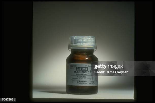 Bottle of Roxane Laboratories' Marinol dronabinol capsules synthetic form of substance in marijuana which causes hunger used as appetite stimulant...
