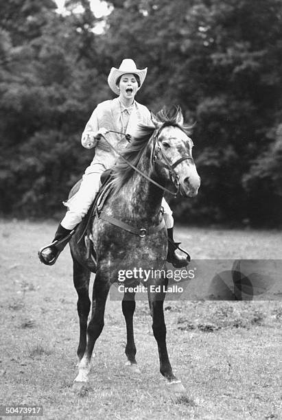 Ex-child actress Claudia Lamb, now a radio talk-show host, riding a dapple horse at Benjamin Ranch.