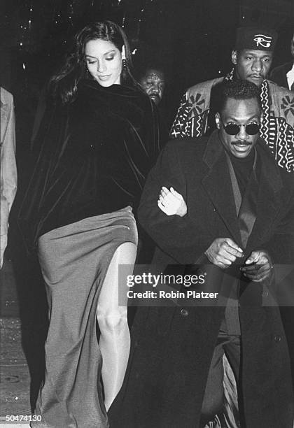 Actor Eddie Murphy and bride-to-be, model Nicole Mitchell on their way to the premiere of his motion picture The Distinguished Gentleman.