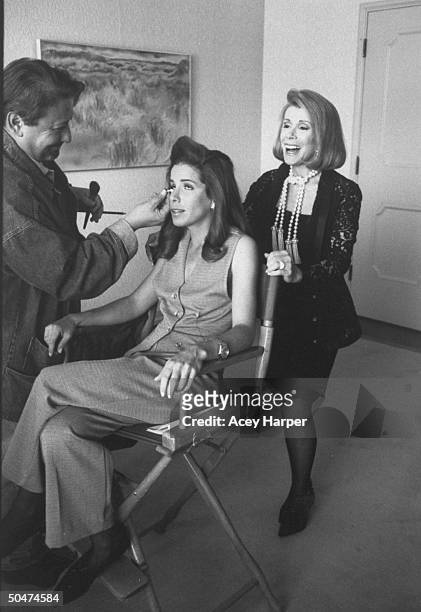 Comedian/actress Joan Rivers joking w. Makeup artist as he touches up daughter Melissa's face behind scenes of Tears & Laughter: The Joan & Melissa...