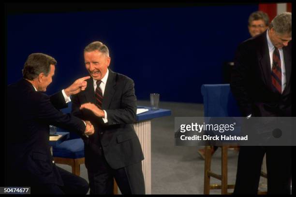 Incumbent Pres. Bush & Independent cand. TX magnate Ross Perot engaging in banter, w. Dem. Contender AR Gov. Bill Clinton , in 2nd campaign debate.