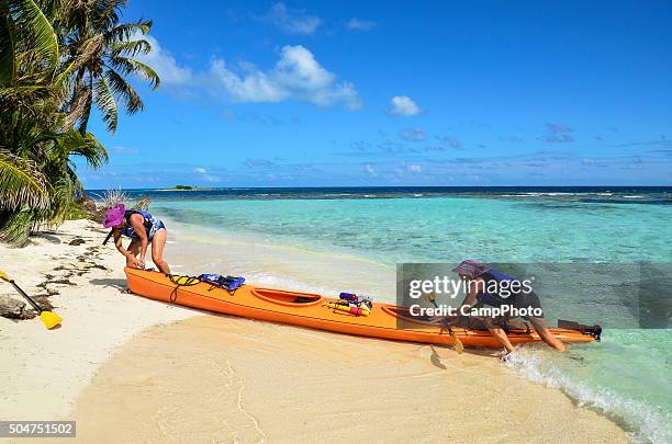 beaching kayak - belize stock pictures, royalty-free photos & images