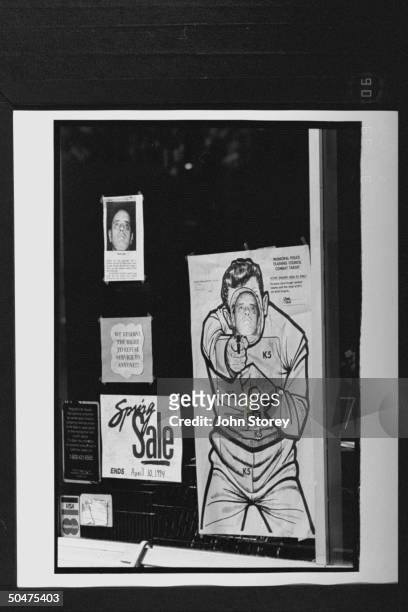 Pic of face of convicted serial rapist Melvin Mac Carter, adhered to a combat target in the form of a man, hanging in the window of Coast to Coast...
