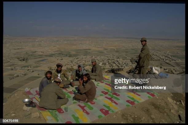 Govt. Soldiers taking break fr. Preparing for battle, 5 km. Fr. Civil war front w. Taliban Islamic student army, at position nr. Bini Hisar.