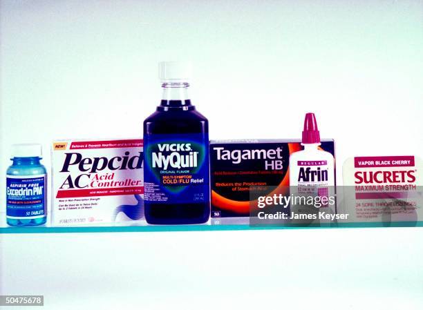 Medicine lineup of over-the-counter medications & formulas including Excedrin PM, Pepcid AC, NyQuil, Tagamet HB, Afrin, & Sucrets.