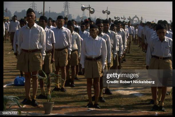 Members of Hindu nationalist Rashtriya Swayamsevak Sangh standing, row formation, at attention during RSS annual function.