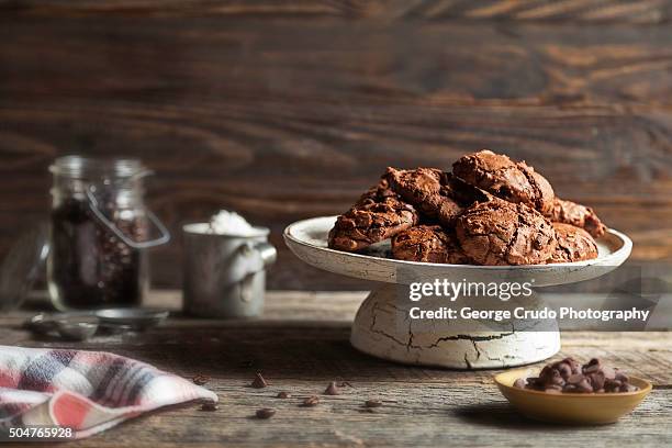 a plate of homemade double chocolate espresso cookies - chocolate ingredient stock pictures, royalty-free photos & images