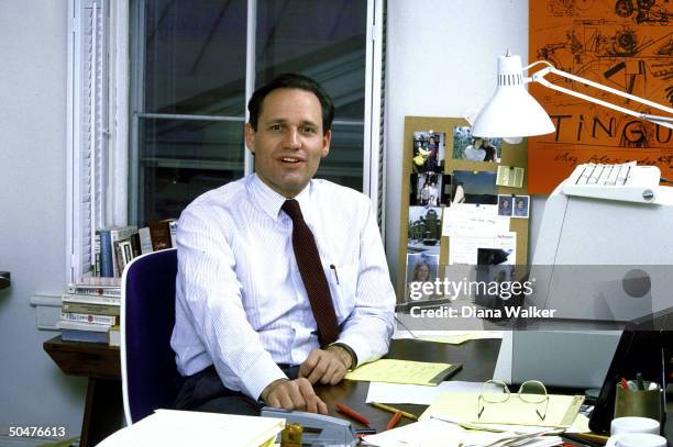 Author/reporter Bob Woodward sitting at desk in his home office.