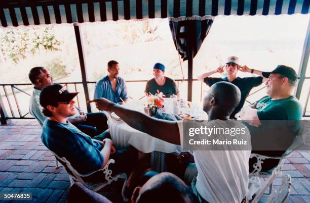 Actor Clark Johnson chatting w. Pal Pete Kowanko, actors Richard Belzer, Jon Polito, Andre Braugher & Kyle Secor, & uncle Duke Johnson while they sit...