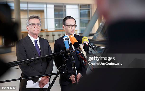 German Interior Minister Thomas de Maiziere and German Justice Minister Heiko Maason giving a statement to the press on January 12, 2016 in Berlin,...