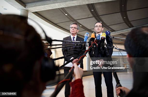 German Interior Minister Thomas de Maiziere and German Justice Minister Heiko Maason giving a statement to the press on January 12, 2016 in Berlin,...