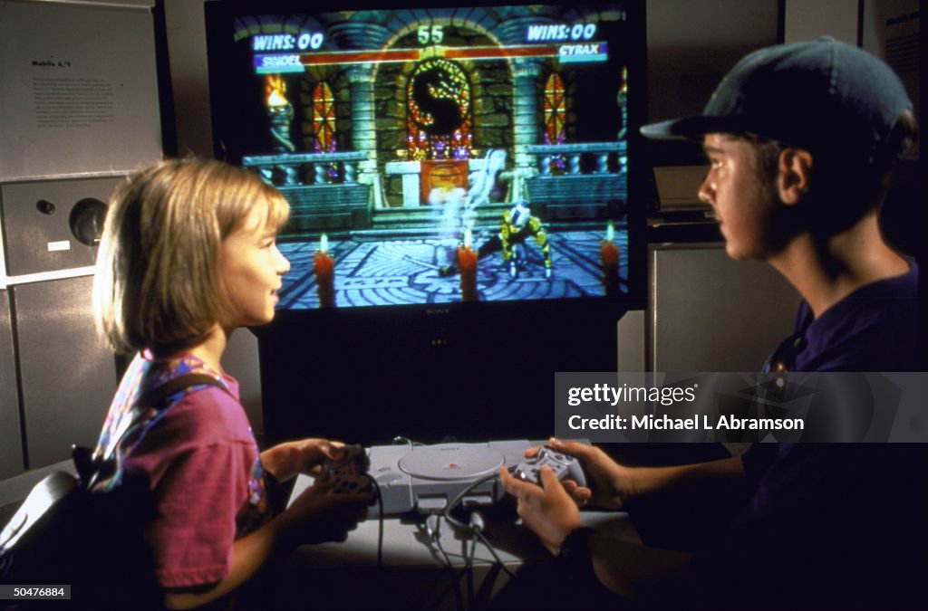 2 young people playing Doom computer gam