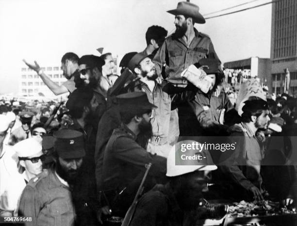 The Cuban rebel leader Fidel Castro , next to the members of his leftist guerrilla movement "26th of July Movement" Camilo Cienfuegos and Ernesto Che...