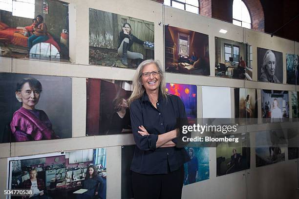 Annie Leibovitz, portrait photographer, poses with her photographs on display at the launch of WOMEN: New Portraits exhibition at Wapping Hydraulic...