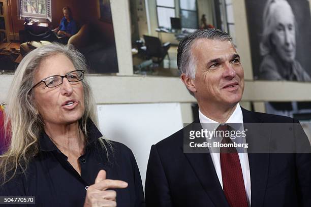 Annie Leibovitz, portrait photographer, left, poses with a photograph with Sergio Ermotti, chief executive officer of UBS AG, at the launch of WOMEN:...