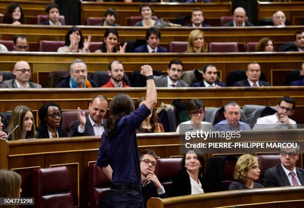 Left wing party Podemos' leader Pablo Iglesias gestures as he takes his seat as lawmaker during the constitution of the Congress, at the Palacio de...
