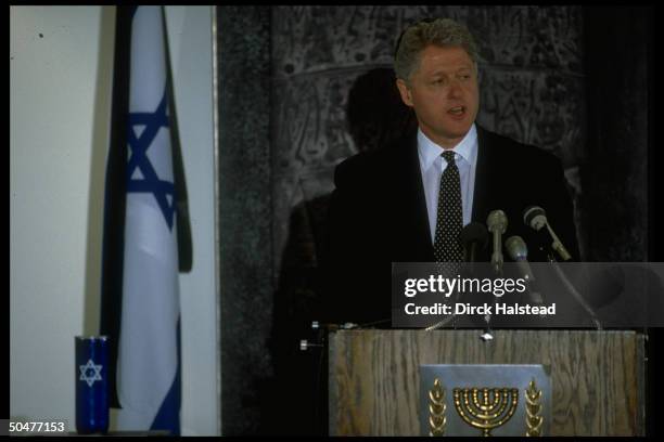 Pres. Bill Clinton speaking at Israeli Embassy, expressing sympathy after fatal terrorist suicide bombings in Israel.