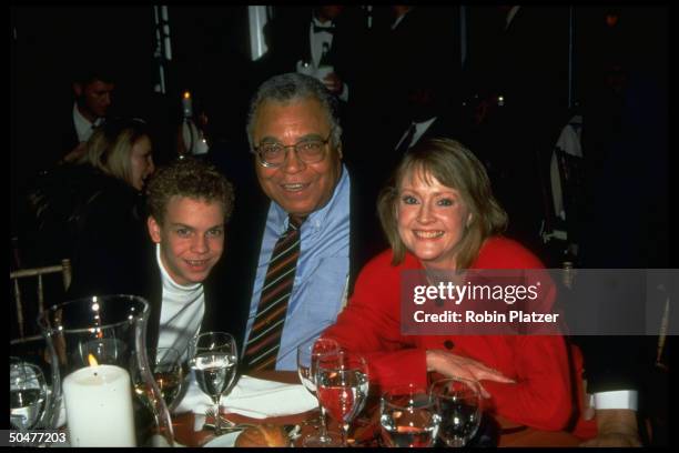 Actor James Earl Jones sitting w. Wife Cecilia & son Flynn at table at NYC benefit for Friends of Nelson Mandela Children's Fund.