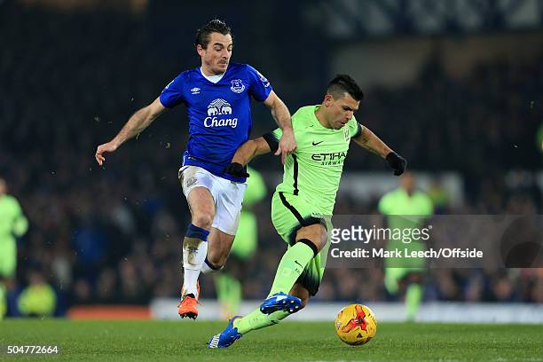 Leighton Baines of Everton battles with Sergio Aguero of Man City during the Capital One Cup Semi-Final First Leg match between Everton and...