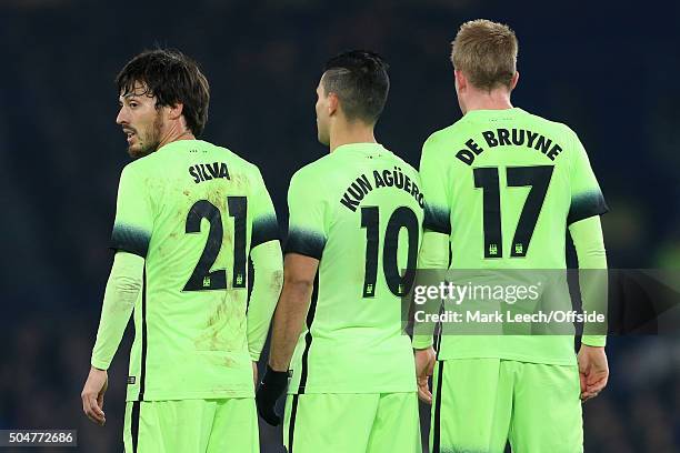 David Silva of Man City stands in the defensive wall alongside teammates Sergio Aguero and Kevin De Bruyne during the Capital One Cup Semi-Final...