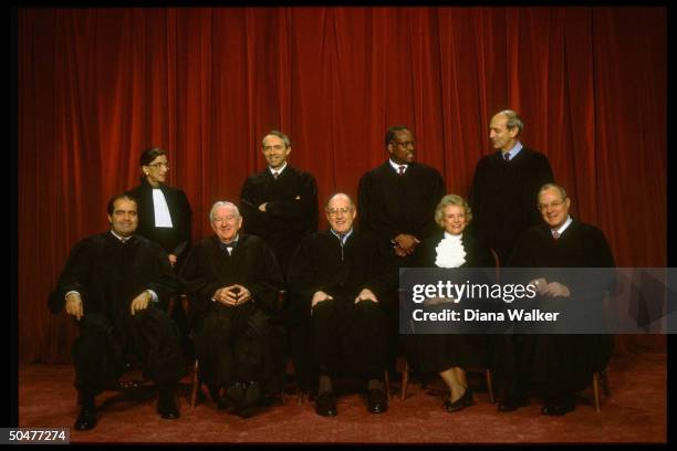 Supreme Court Justices Scalia, Ginsburg, Stevens, Souter, Chief Rehnquist, Thomas, O'Connor, Breyer & Kennedy in formal portrait.