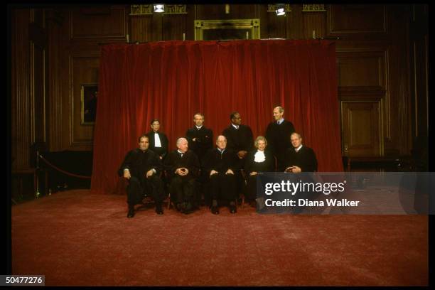 Supreme Court Justices Scalia, Ginsburg, Stevens, Souter, Chief Rehnquist, Thomas, O'Connor, Breyer & Kennedy in formal portrait.