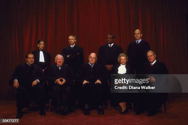 Supreme Court Justices Scalia, Ginsburg, Stevens, Souter, Chief Rehnquist, Thomas, O'Connor, Breyer & Kennedy in formal portrait.