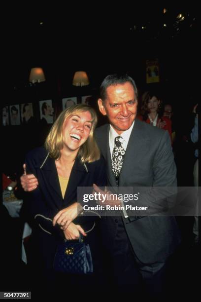 Actor Tony Randall w. Arm around 25-yr-old actress wife Heather Harlan at opening night party for play School for Scandal.