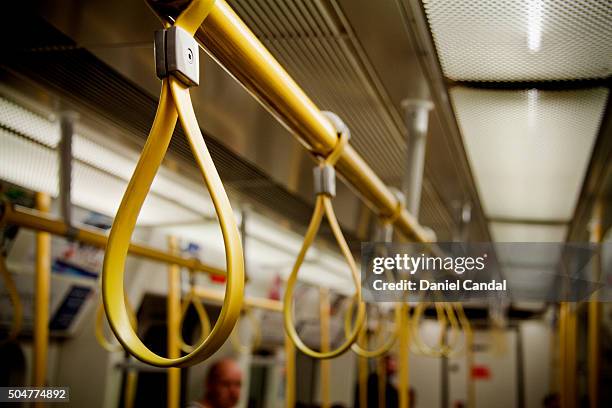 handles in london underground (united kingdom) - train interior stock pictures, royalty-free photos & images