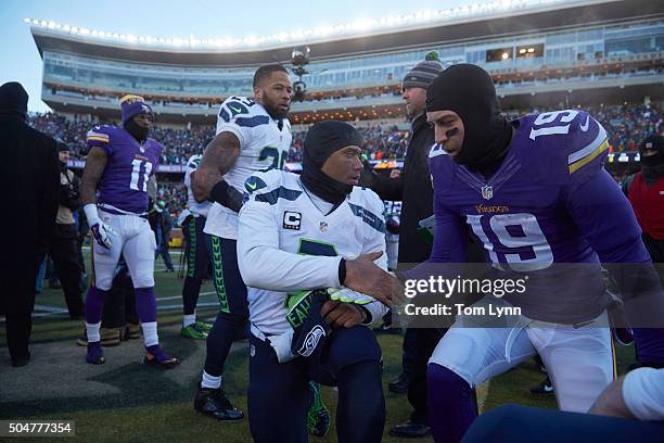 Playoffs: Seattle Seahawks QB Russell Wilson shaking hands with Minnesota Vikings Adam Thielen after game at US Bank Stadium. Minneapolis, MN...