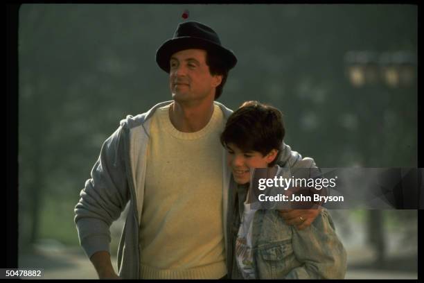 Actor Sylvester Stallone w. Arm around son, Sage, in scene fr. Motion picture Rocky V..