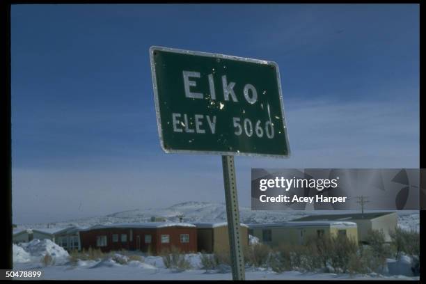 Road sign reading ELKO/ELEV 5060 at entrance to town, which is site of annual Cowboy Poetry Gathering.