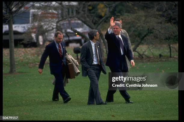 Pres. Bill Clinton waving, walking WH lawn w. Aides Bruce Lindsey & Mack McLarty in tow, departing .