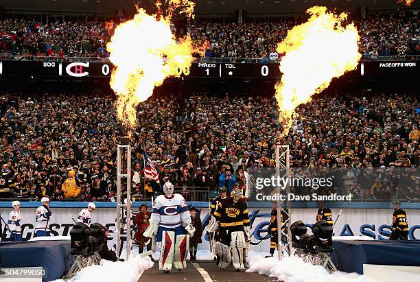 Goaltenders Mike Condon of the Montreal Canadiens and Tuukka Rask of the Boston Bruins lead their teammates onto the field before the 2016...