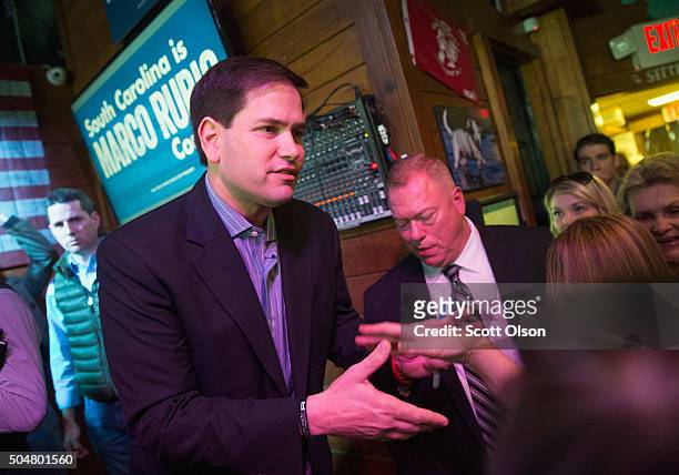 Republican presidential candidate Sen. Marco Rubio greets guests during a campaign rally at the Water Dog Grill on January 13, 2016 in Mount...