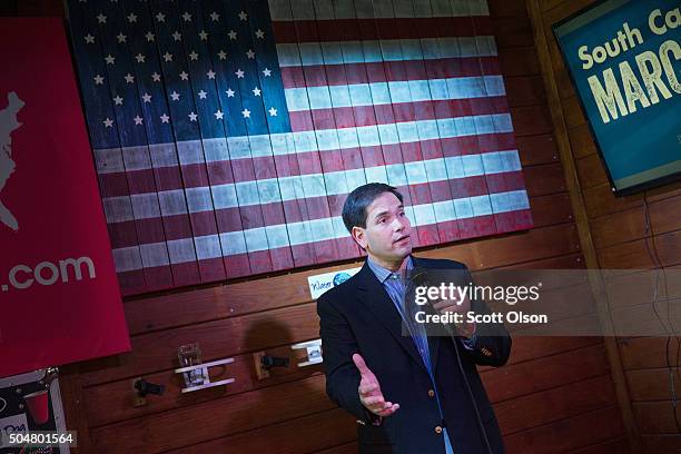 Republican presidential candidate Sen. Marco Rubio speaks to guests during a campaign rally at the Water Dog Grill on January 13, 2016 in Mount...